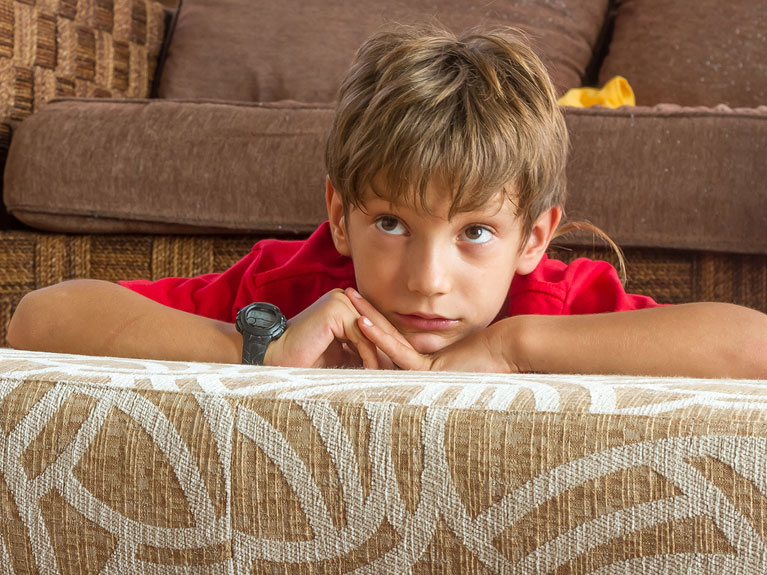 Child staring at TV